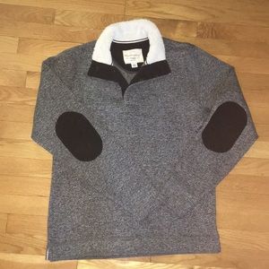 Gray sweater, with fuzzy collar + elbow patches.